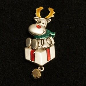 Vintage AJMC Reindeer on Gift Brooch Bell Dangle Christmas Pin Rudolph